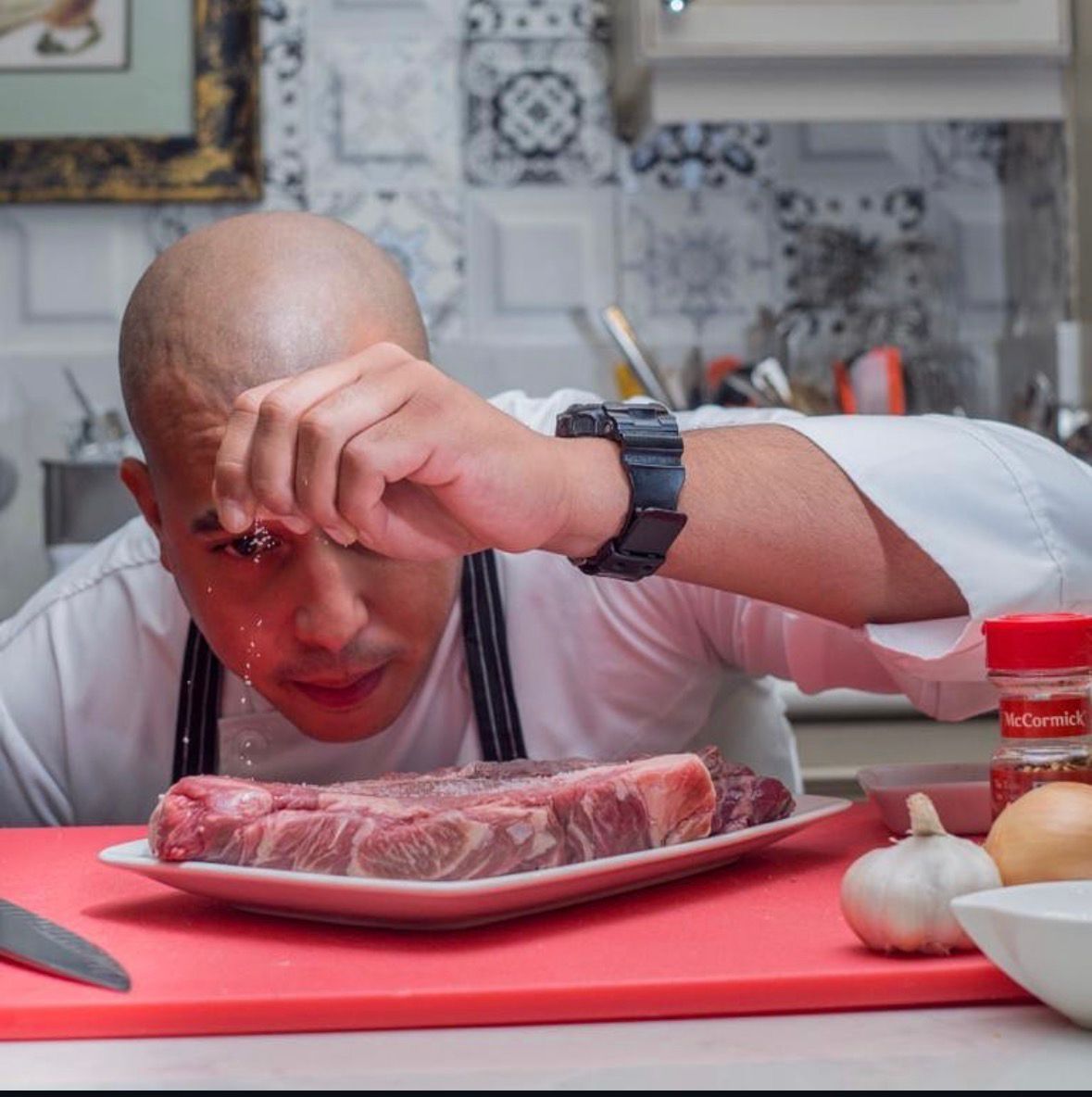 Chef Irving seasoning a steak